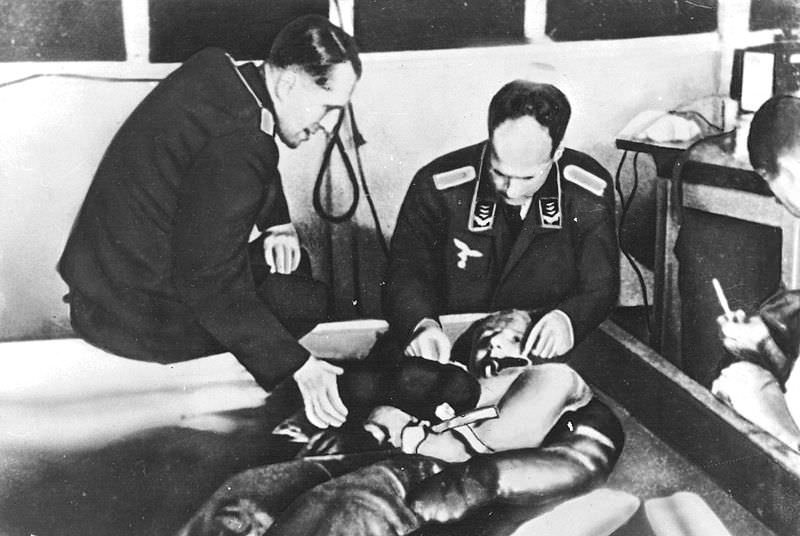 Nazi officers perform experiements by putting Jewish inmates in freezing cold water to study ways to protect against hypothermia in 1942.