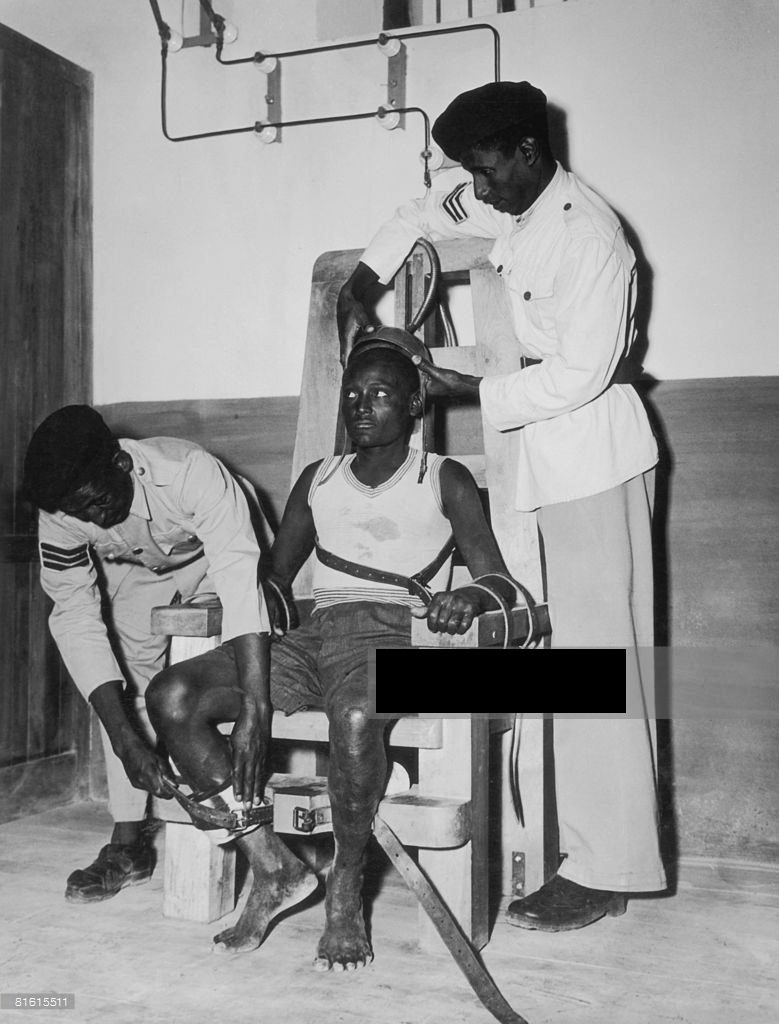A man being strapped into an electric chair in Addis Ababa prison in Ethiopia in 1950.