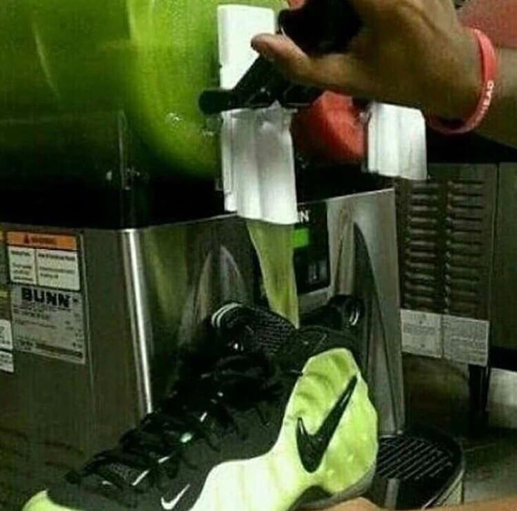 pouring a drink into nike sneakers