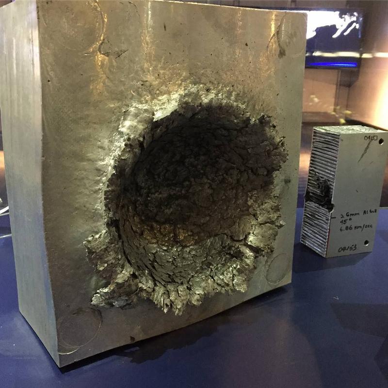 This is the damage a 1/2oz of space debris going 15,000 mph does to a block of solid aluminum