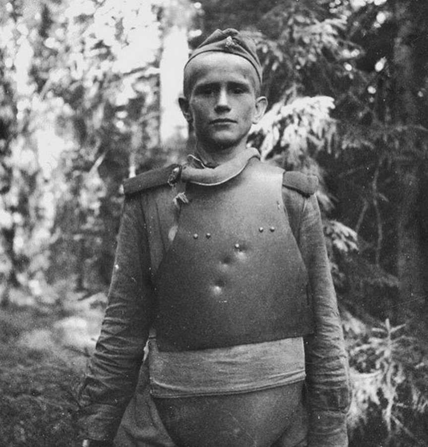 A young Russian combat engineer wearing body armor that saved his life on the Karelian Front during WWII in 1944.
