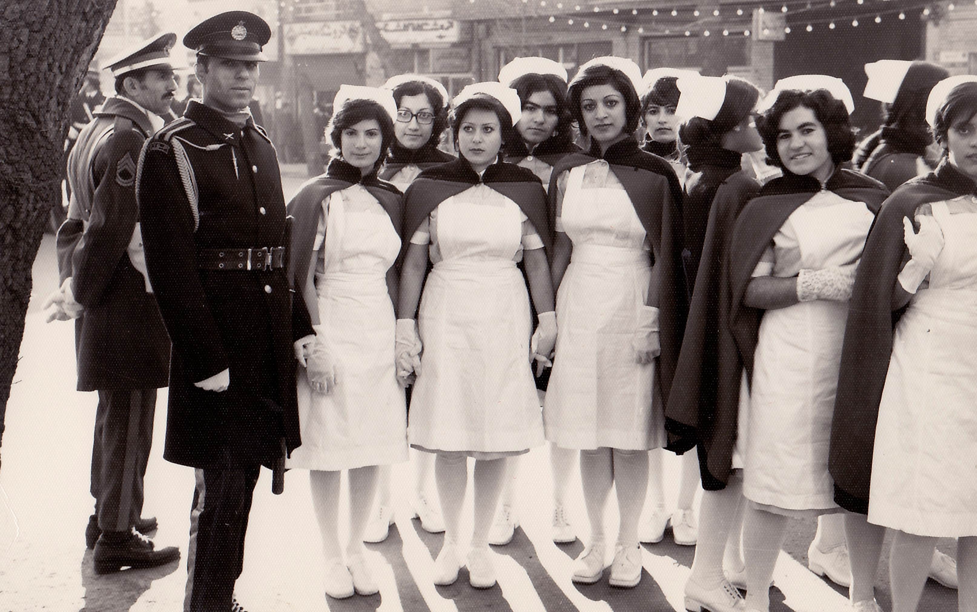 Nurses and soldiers pose for a picture in Iran in 1968.