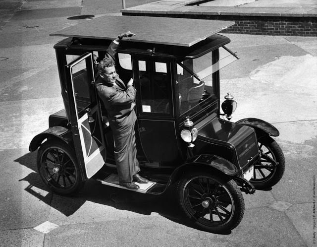 Dr. Charles Alexander Escoffery shows off his Baker Electric Mode car that can run on solar energy using a 1912 car in the US in 1960.