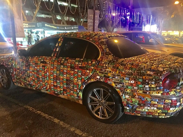 This car is covered with smaller cars.