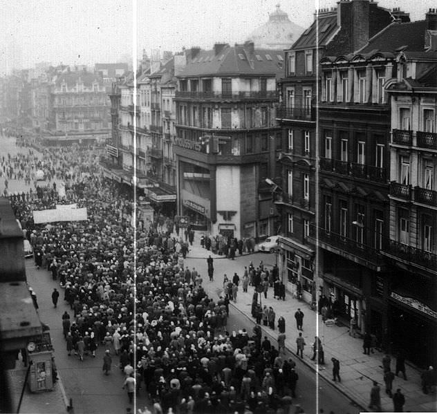 People taking part in a general strike line the city of Brussels, Belgium in 1960. The strike occurred over 6 weeks in the winter of 1960-61 against the the proposed Law on Economic Growth, Social Progress and Fiscal Redressment. The law was designed to reduce Belgium’s large government debt and to respond to the independence of the Belgian Congo in 1960. Around 700,000 workers went out on strike out of a countries entire population of 9.1 million, shutting down key areas for weeks. Unfortunately, the various groups of workers were not in perfect unison, and factions broke off and went back to work shortly after the strikes began. This gave the general strike problems, and after 6 weeks it failed. The law did pass in 1961 regardless of these actions, but some other major political changes did arise in Belgium with such powerful demonstrations.