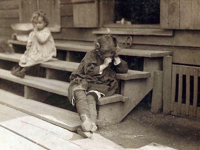 Five year old girl, after a day’s work that began at 5am, was tired and refused to be photographed. The mother said, “Oh, she’s ugly, and picking shrimp is very hard on the fingers.” Biloxi, MS, 1911,