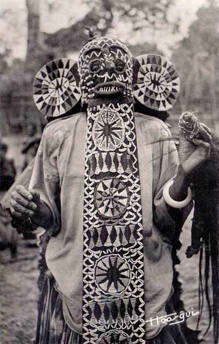 A man wears a tribal mask in Cameroon in 1969.