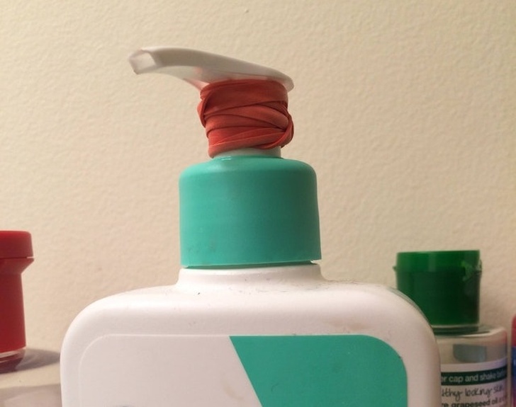 To prevent dispensers on bottles from leaking on trips, wrap them with rubber bands.