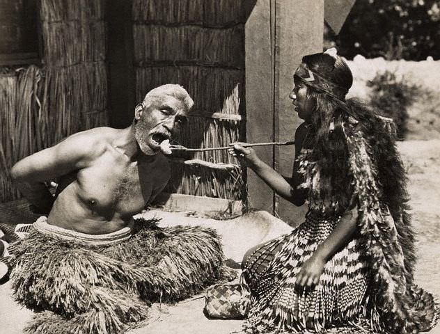 A Maori priest being fed in New Zealand in 1930.