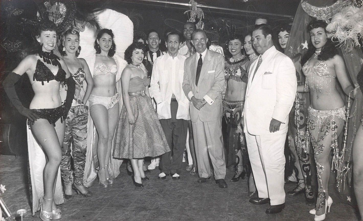 Executives, managers and showgirls pose for a picture at the Tropicana Night Club in Havana, Cuba in 1954.