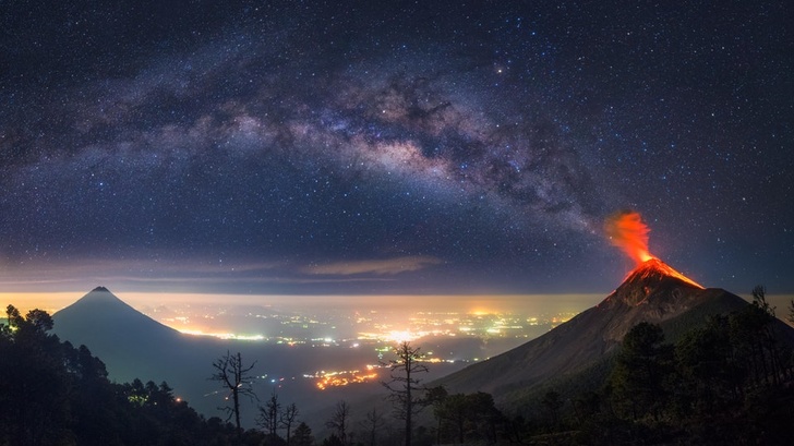 The Milky Way coming out of an erupting volcano, Guatemala