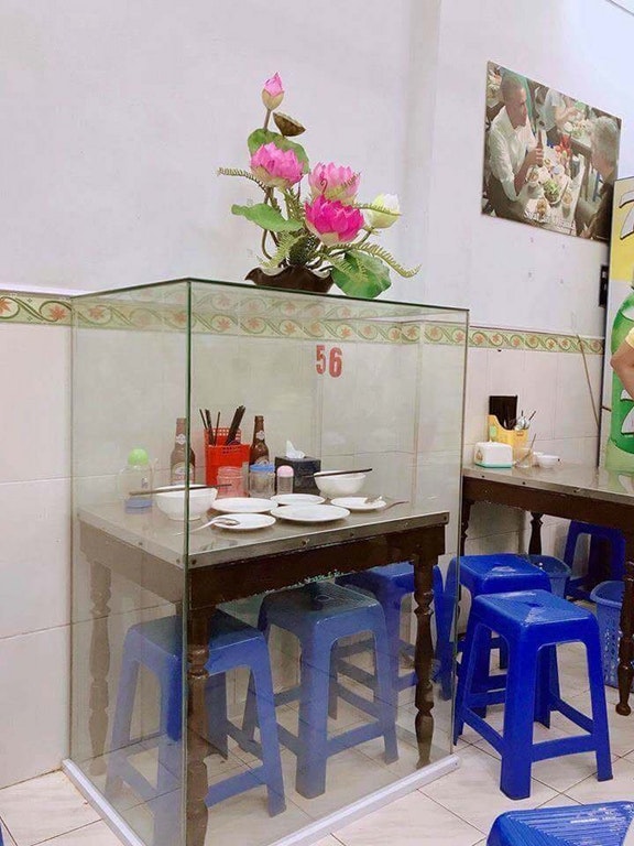 This restaurant in Vietnam was so honored by the visit that they framed the table and stools.