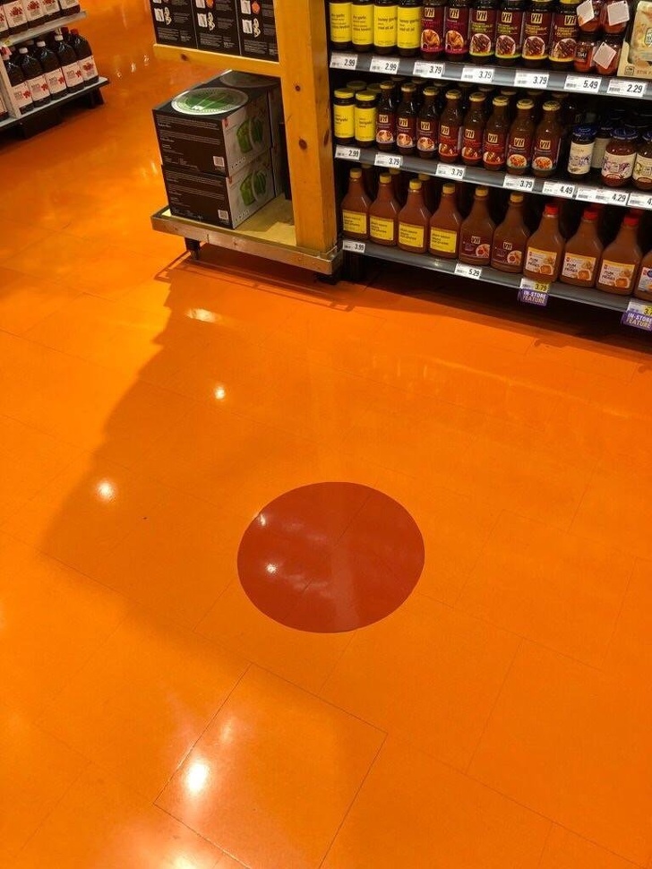 This grocery store that used to be a hockey arena still has the center of the ice marked.