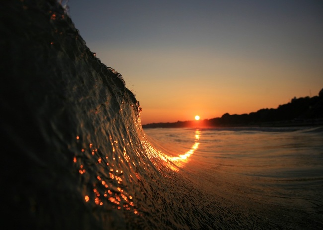 Sun curling up a wave