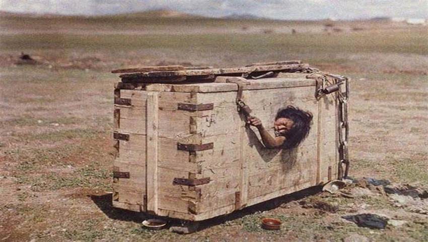 A woman put in a sealed box with 1 small hole for the punishment of adultery in Mongolia in 1913. The sentence is actually death, as she will stop being fed or given water and slowly die of thirst in the hot box under the sun.