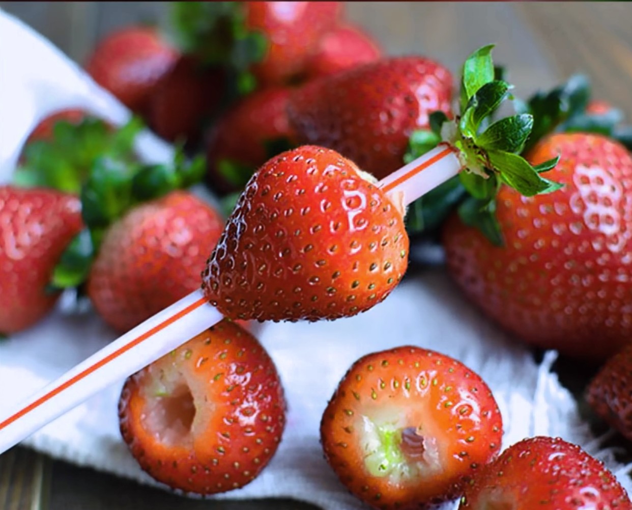 Use a straw to remove stems from the strawberries