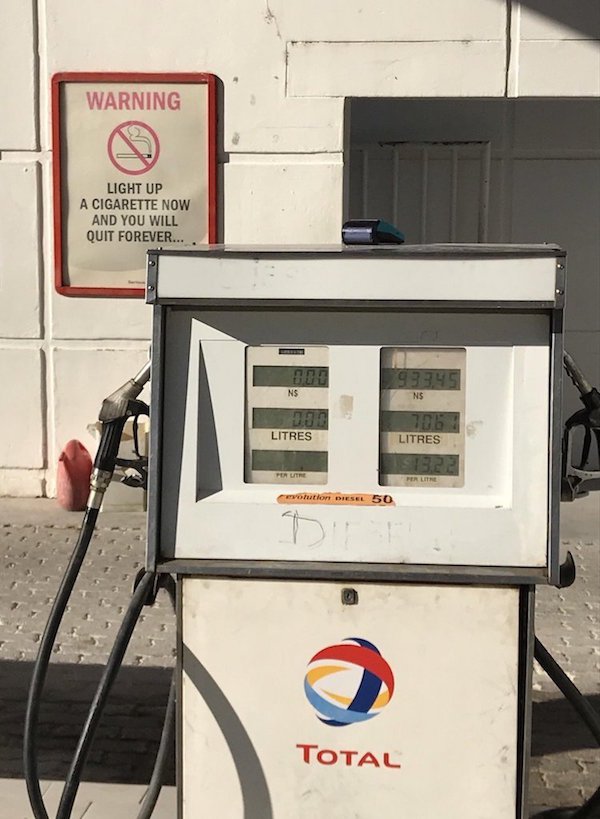 gas pump - Warning Light Up A Cigarette Now And You Will Quit Forever... 93945 Ns Litres Litres outlon Diesel 50 Total