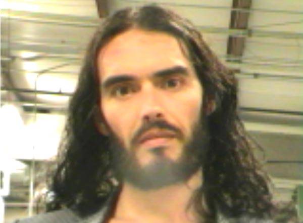 Russell Brand was arrested in March 2012 by the New Orleans Police Department and charged with criminal damage after a paparazzi alleged that the British comedian tossed his iPhone through a window. Brand, 36, was booked into the Orleans Parish Sheriff’s jail where he posed for the above mug shot before being released on $5000 bond.