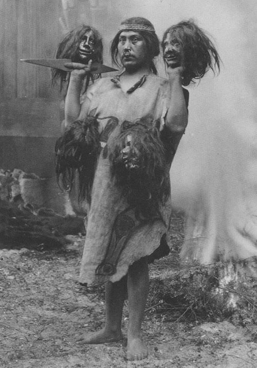 A man from the Amazon in Brazil with shrunken human heads in 1925.