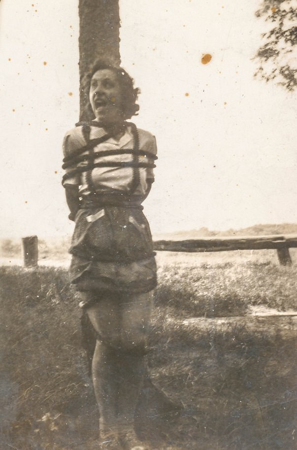 A woman tied to a tree for a bondage role play in the US in 1936.
