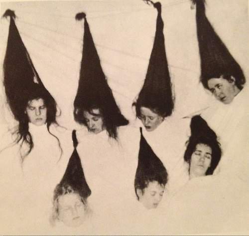 Women pretend to be dead severed heads for a creepy picture shoot using trick photography in the US in 1908.