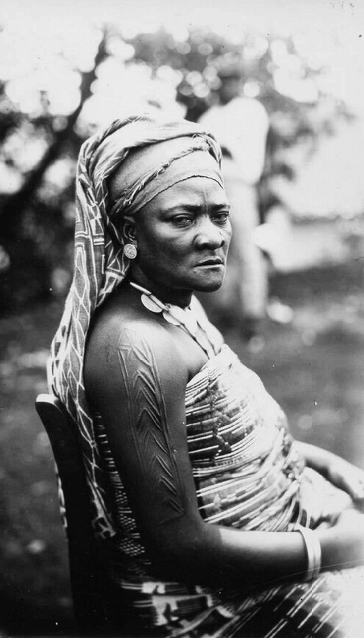 A woman poses for a picture much to her chagrin in the Republic of Congo in 1958.