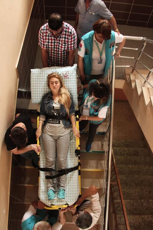 Hospitalized Turkish woman is being carried to the polling station to vote for the historic election. Voter turnout is expected to be over 90%.