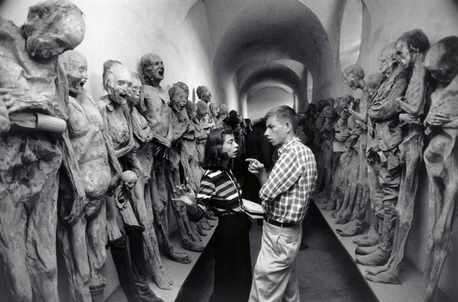 A curator shows a man the mummies at the Museo de las Momias in Guanajuato, Mexico, in 1957.