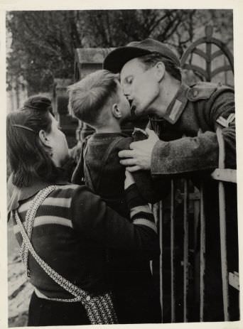 A soldier kisses his son goodbye in Germany in 1938.