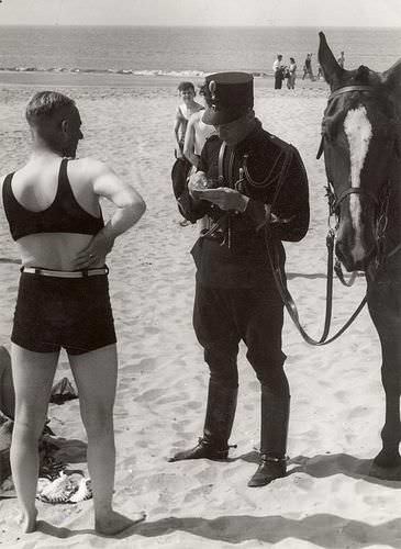 A man is fined for not wearing the proper male bathing suit in The Netherlands in 1931.