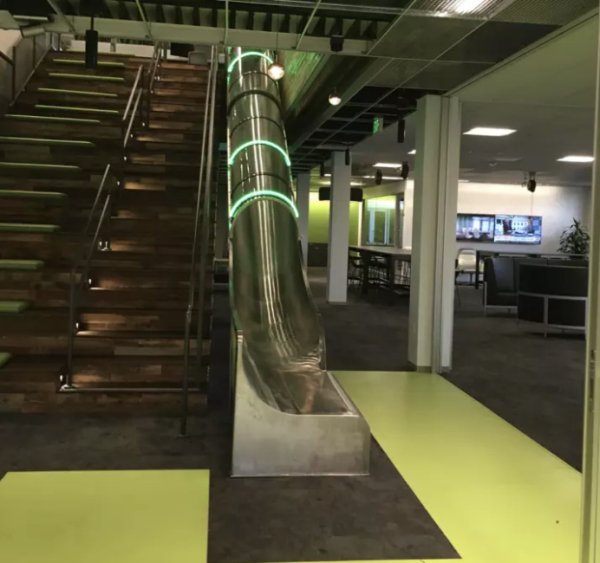 And also this office that has a slide to make going down a floor fun.