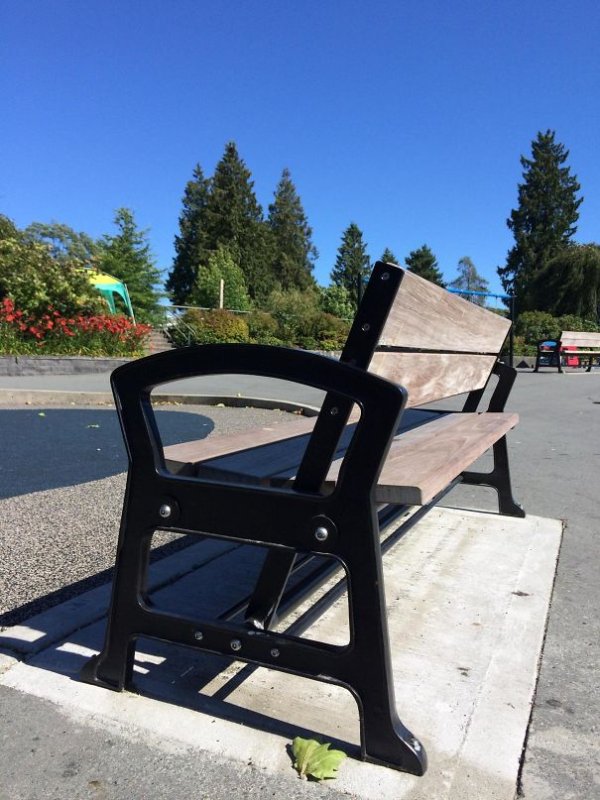 The back of this park bench can pivot back and forth, allowing the user to face either direction.