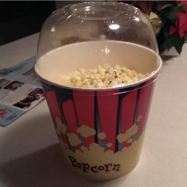 This theater offers popcorn with a lid so you can shake the butter around, then use as a bowl.