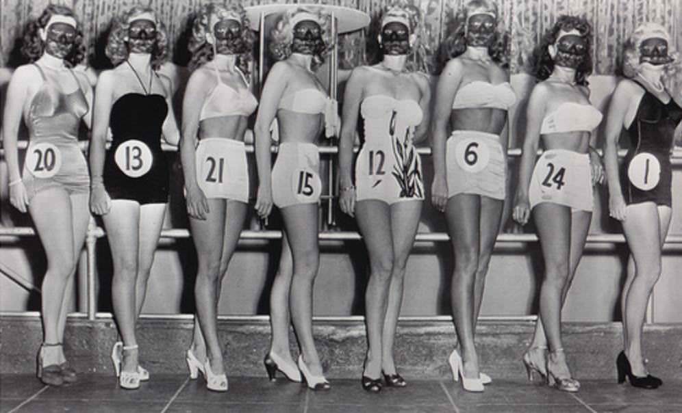 Woman wear masks at a best figure beauty pageant in LA, US in 1952.