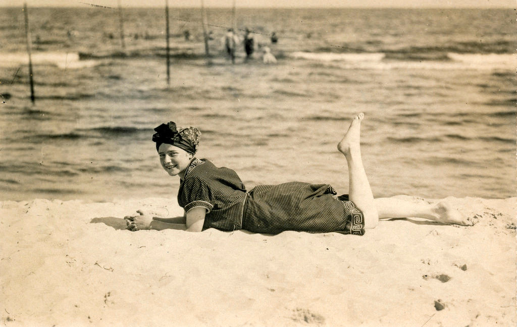 A young woman lying on the beach in Kołobrzeg, Poland in 1912.