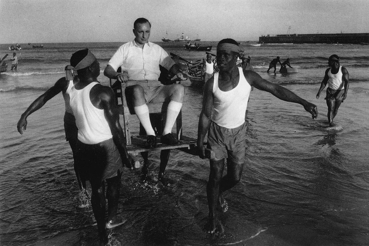 Workers carrying a man at the Port d'Accra in Ghana in 1960.