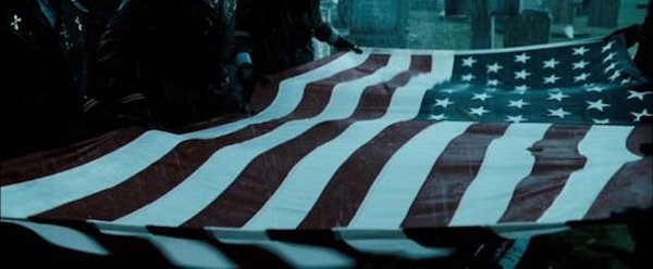 In Watchmen (2009), the flag draped over The Comedian’s coffin at his funeral has 51 stars on it. This is due to, in the alternative 1985 Watchmen timeline, Vietnam becoming a US state after the winning intervention of Dr. Manhattan.