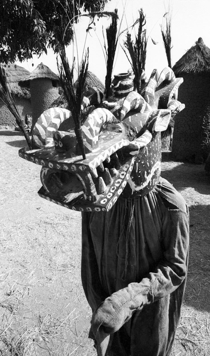 A man dressed as a mythical figure of the Senufo people in Burkina Faso in 1952.