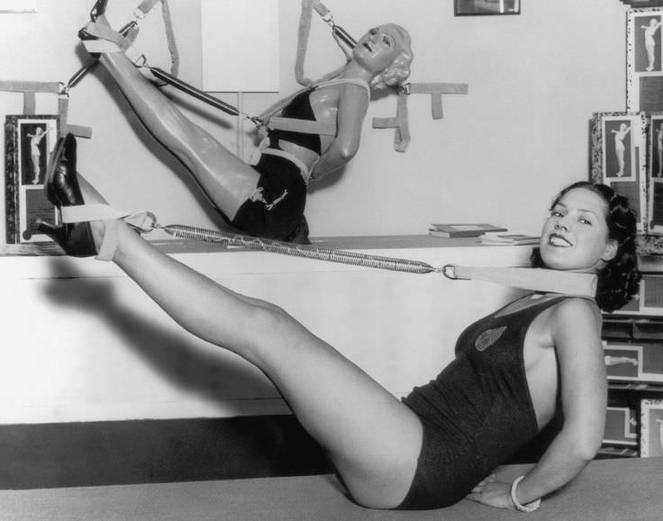 A model shows off an excersize device in the US in 1937.