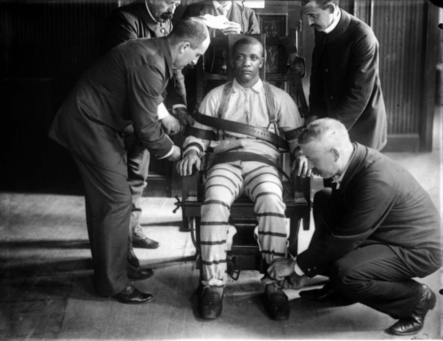A man being strapped to an electric chair at Sing Sing prison in New York, US in 1926.