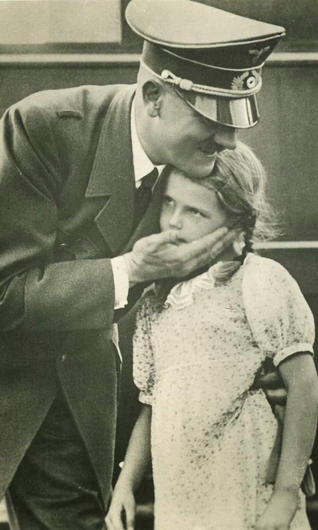 Adolf Hitler with one of Joseph Goebbels children in Germany in 1942.