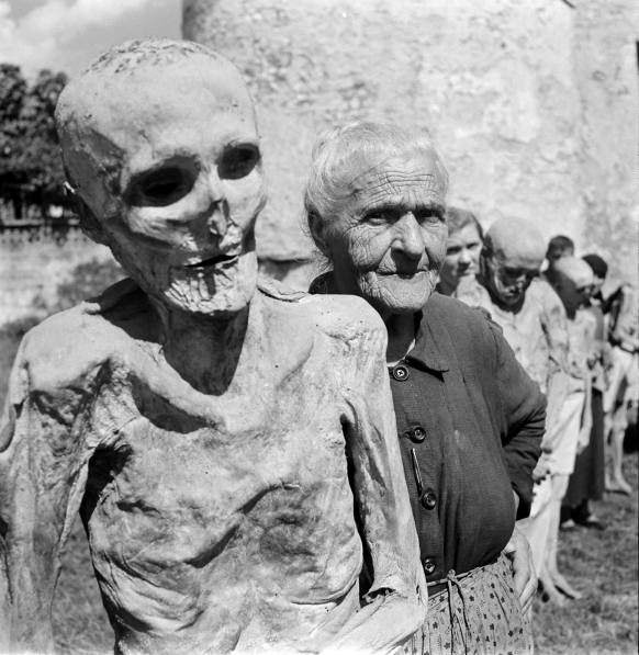 Locals pull out the mummies of the cathedral of Venzone in Italy for a photo shoot with Life Magazine in 1962. The mummies go back to the 1600s and are still on display today.