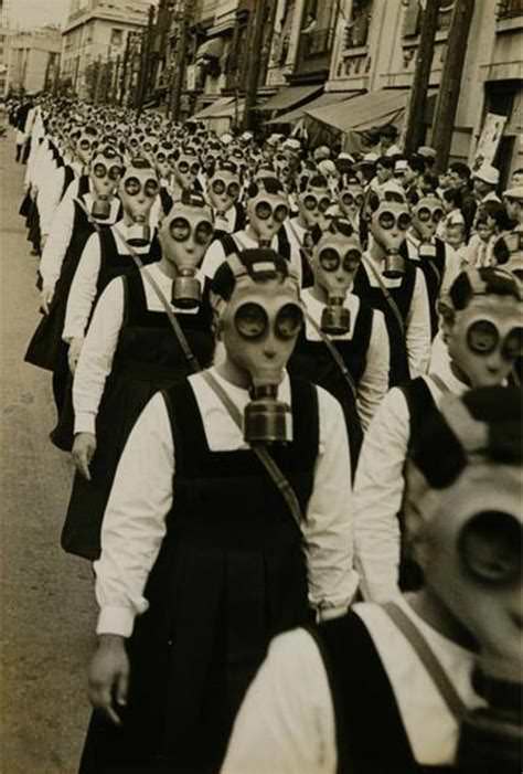 Schoolgirls wearing gas masks march in a parade in Japan in 1944.