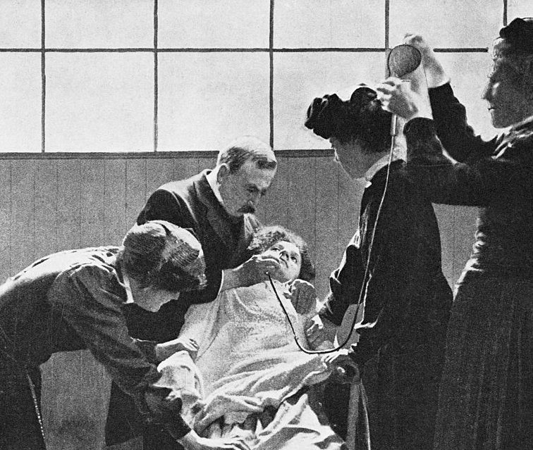 A doctor forcibly feeds a female suffrage prisoner through her nose while nurses hold her down in London, England in 1912. Suffragettes arrested in England were sometimes punished as criminals, with some methods more drastic than others.
