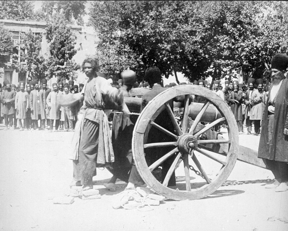 A man is about to be executed by cannon, known as "Blowing from a gun", in the Ottoman Empire in 1911.