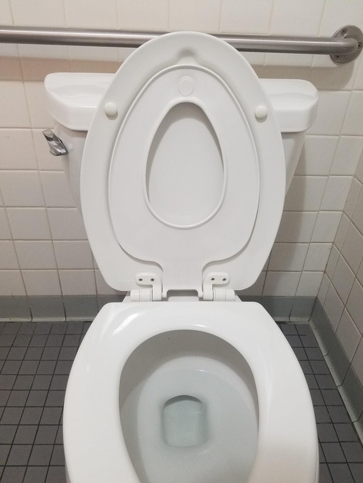 This toilet seat has another smaller seat inside for kids.