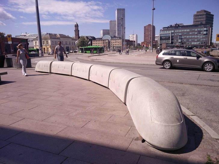 Train-shaped benches outside a train station