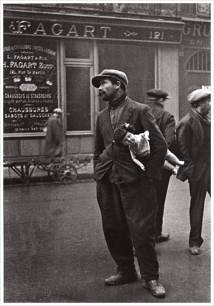 A man with a doll in France in 1931.