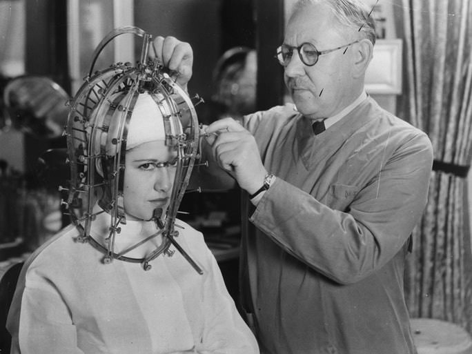 Maksymilian Faktorowicz, better known as Max Factor Sr., using one of his patented beauty devices on a model in LA, US in 1936.