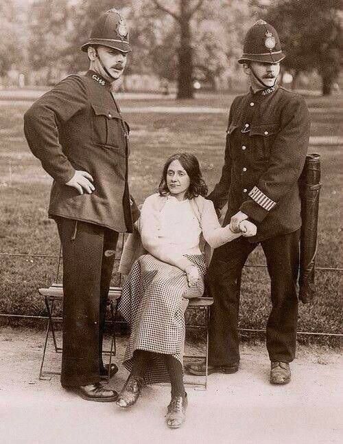 2 Officers prepare to arrest a suffragette in London, England in 1912.